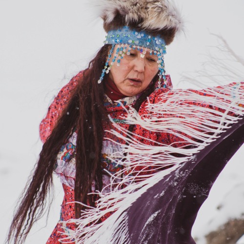 "Portrait of an indigenous woman adorned with traditional accessories, signifying generational memories and healing.